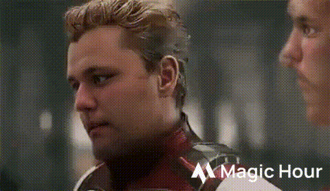 Bearded Man Talking to Man in Superhero Costume