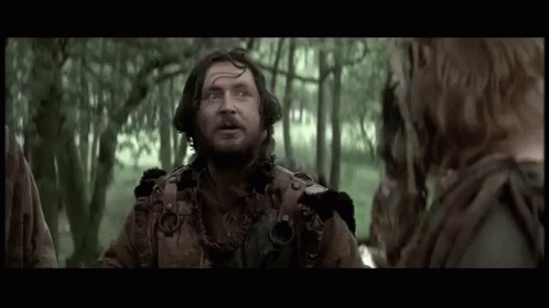Bearded Man Talking to Woman in Woods