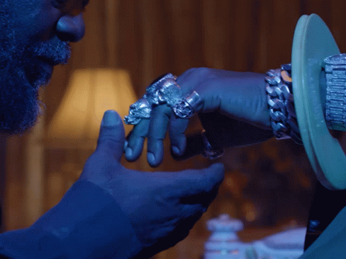 Bearded Man Touching Ringed Hand