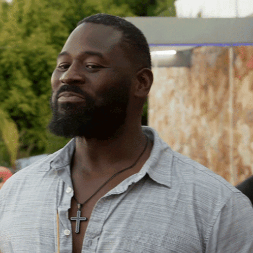 Bearded Man Wearing Cross Necklace