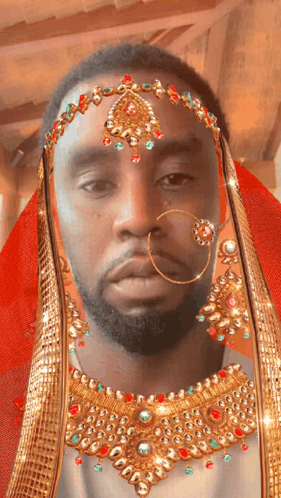 Bearded Man Wearing Gold Jewelry
