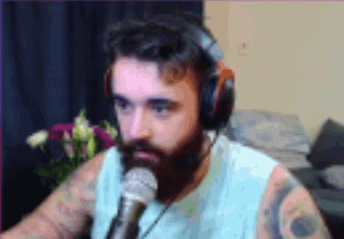 Bearded Man Wearing Headphones and Microphone