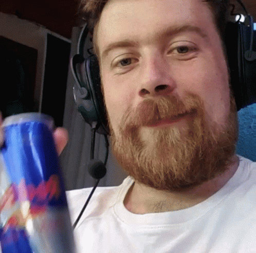 Bearded Man Wearing Headphones Holding Red Bull GIF