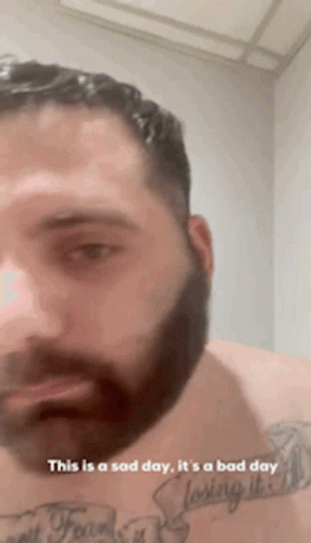 Bearded Man With Chest Tattoo Says This Is a Sad Day