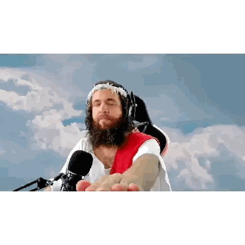 Bearded Man With Crown of Thorns and Headphones Reaching for Mic