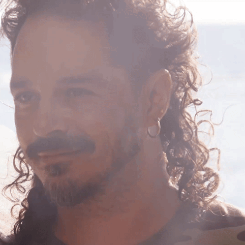 Bearded Man with Curly Hair and Hoop Earring