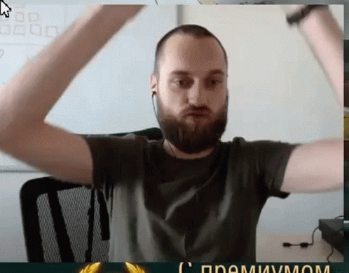 Bearded Man With Ear Buds Arms Raised GIF