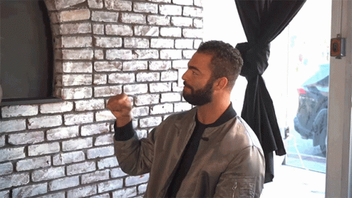 Bearded Man With Fist In The Air GIF