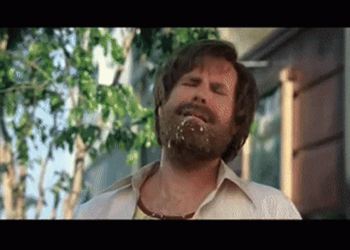 Bearded Man With Food in Mouth