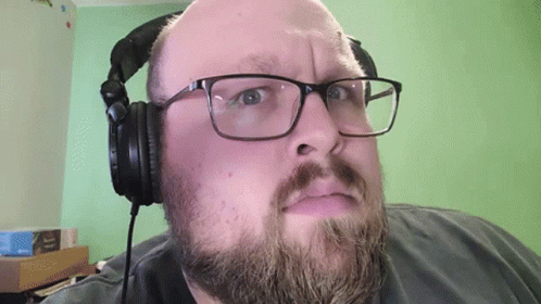 Bearded Man with Glasses and Headphones