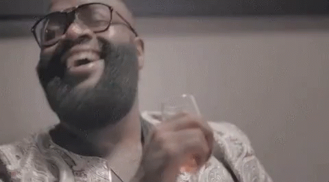 Bearded Man With Glasses Holding Whiskey GIF