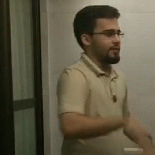 Bearded Man with Glasses in Bathroom