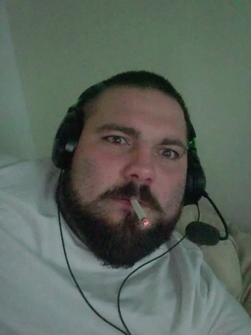 Bearded Man With Headphones and Cigarette