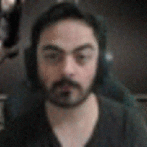 Bearded Man With Headphones and Microphone