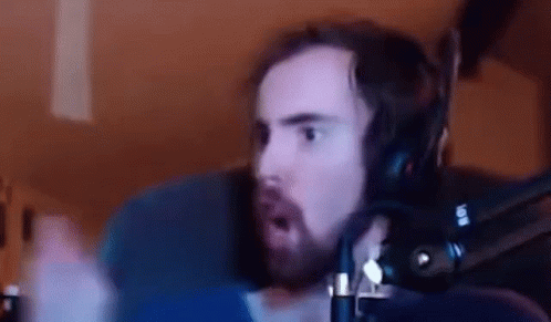 Bearded Man With Headphones Making Funny Face At Microphone