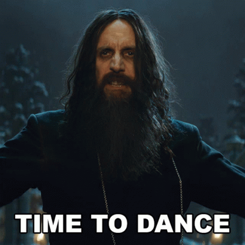 Bearded Man with Long Hair at Time to Dance Sign