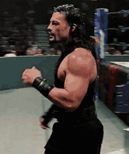 Bearded Man With Long Hair Fist in Air in Ring