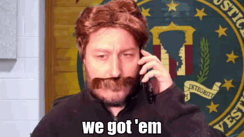 Bearded Man With Mustache On Phone Says We Got Em GIF