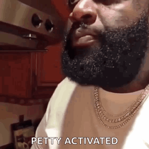 Bearded Man with Necklace Says Petty Activated
