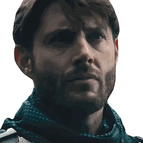 Bearded Man with Scarf Looks at Camera