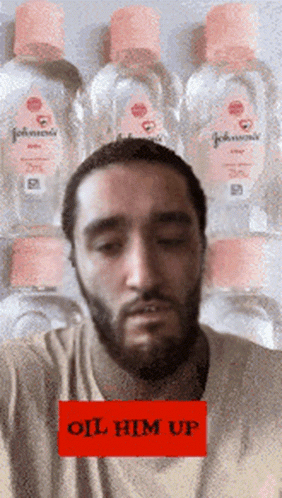 Bearded Man With Stack Of Johnson's Baby Oil GIF