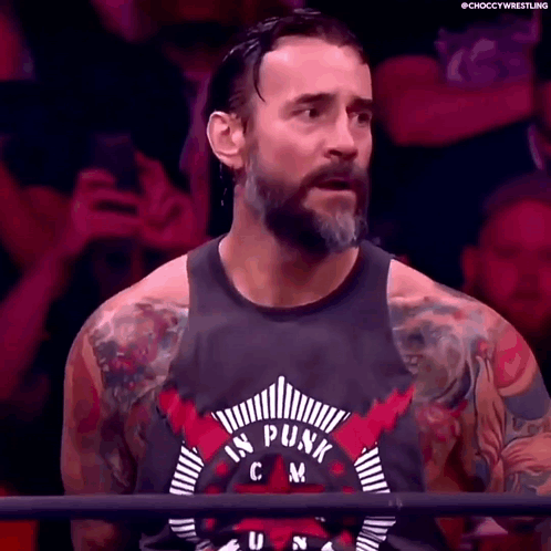 Bearded Man with Tattoos in Punk Tank Top