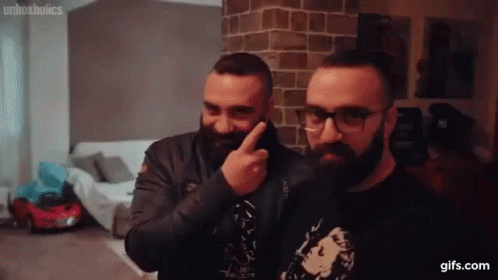 Bearded Men in Glasses Pointing at Face