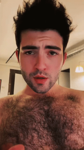 Bearded Shirtless Man Looking at Camera