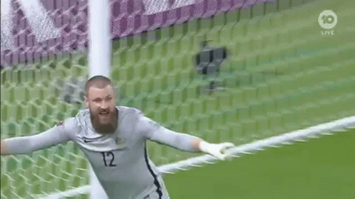 Bearded Soccer Goalie Jumping In Front Of Net GIF