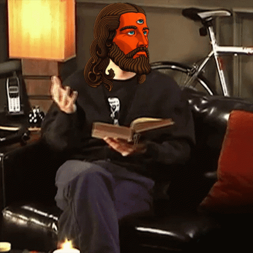 Bearded Three-Eyed Man Sitting on Couch With Book