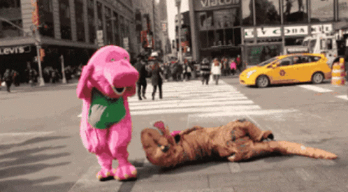 Pink Mascot Beat Up T-rex On Floor GIF