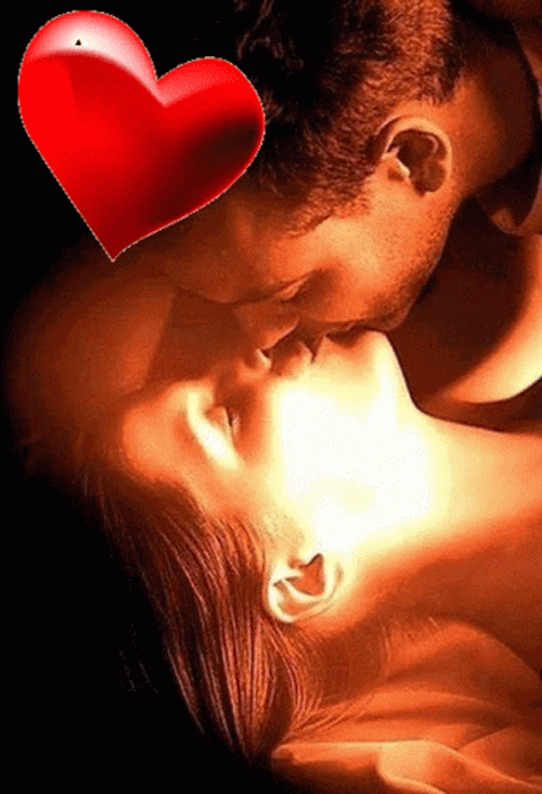 Beating Heart Over Couple Kisses GIF
