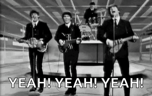 Beatles Playing Guitars and Singing