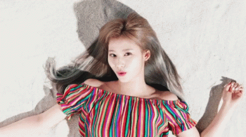 Beautiful Sana Laying Down On The Sand GIF