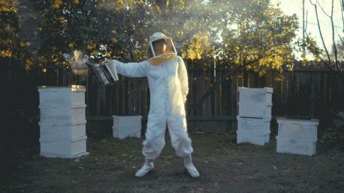 Beekeeper Dancing And Using Smoker GIF