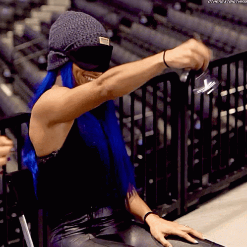 Blind-folded Girl Bell Ringing GIF
