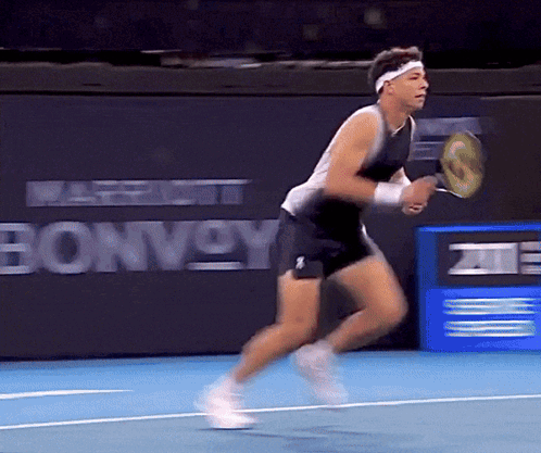 Ben Shelton Striking Tennis Ball Downward GIF