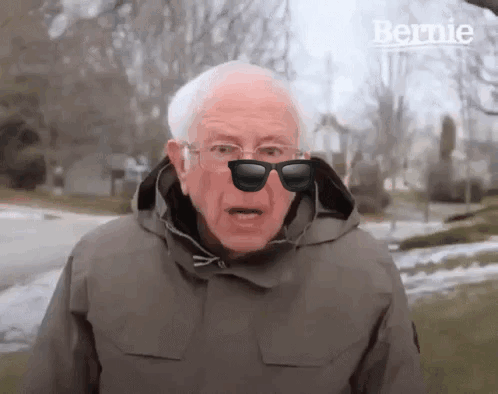 Bernie Sanders Wearing Sunglasses And Hooded Jacket GIF
