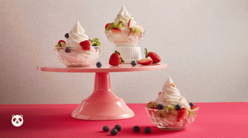 Berries And Cream In Moving Glass Bowls GIF