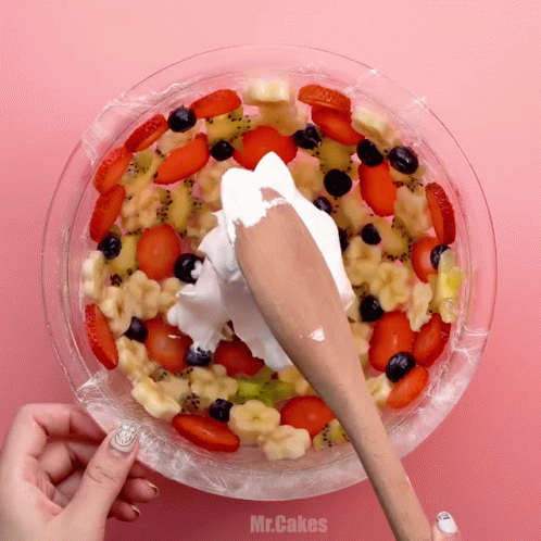 Berries And Cream Topped With Bread Slices GIF