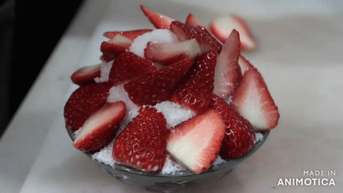 Berries And Cream Topped With Sliced Fruit GIF