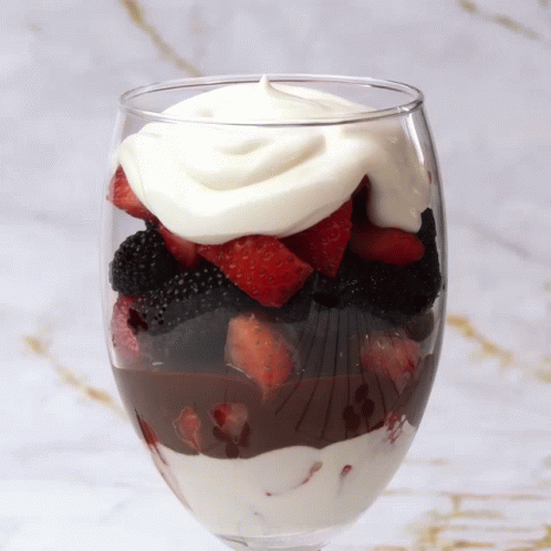 Berries And Cream With Chocolate Syrup In Glass GIF