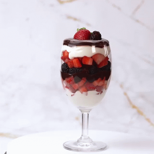 Berries And Cream With Chocolate Syrup Spinning Glass GIF