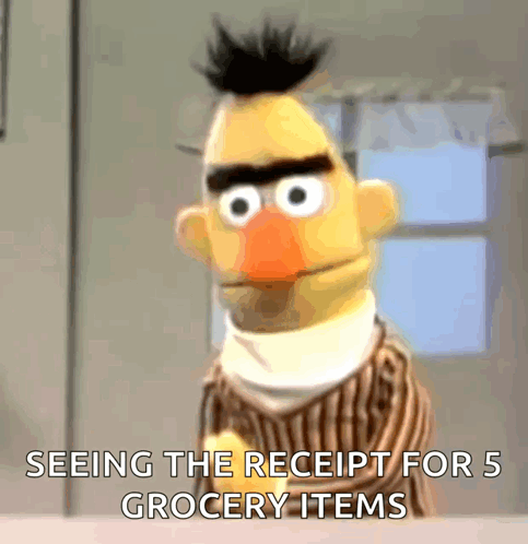 Bert From Sesame Street Is Looking At A Receipt For 5 Grocery Items GIF