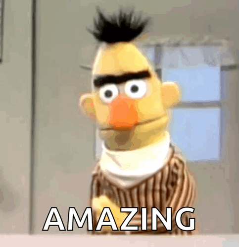 Bert From Sesame Street Is Standing In Front Of A Window With The Words Amazing Below Him GIF