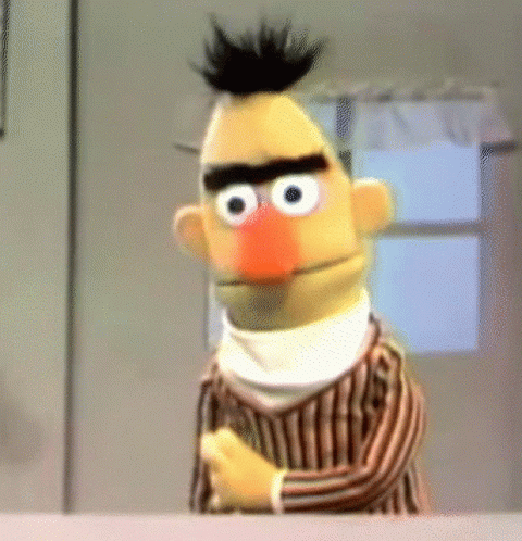 Bert From Sesame Street Is Wearing A Striped Shirt And Scarf GIF