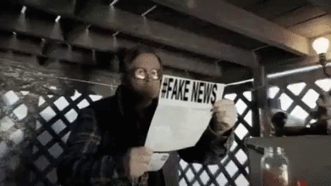 Big Eyes Reading Fake News GIF