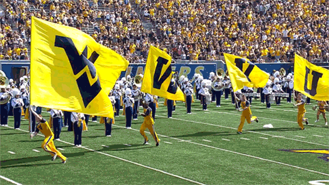 Big Flags Of Mountaineers Carried By Four Men GIF