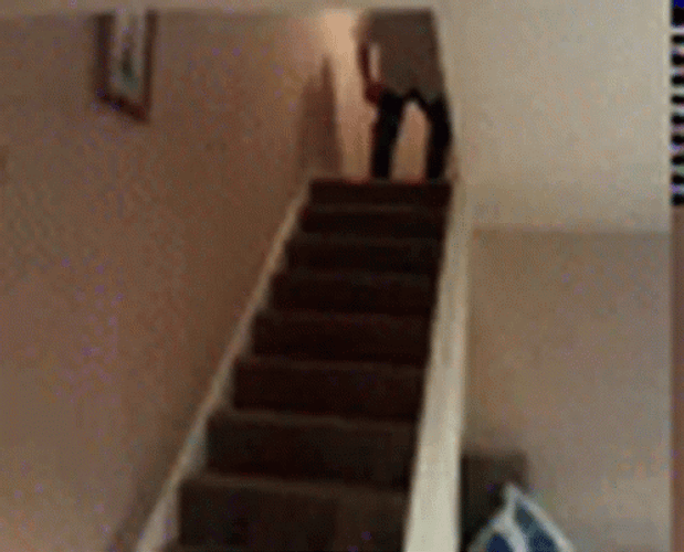 Big Guy Falling Down Stairs At Home GIF
