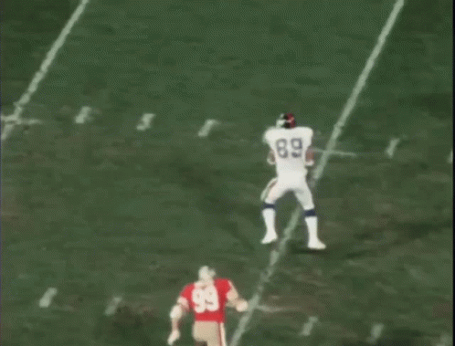 Big Hits Football Players Midfield Pile Up GIF
